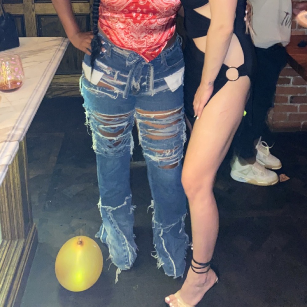 Custom made, destroyed denim jeans.